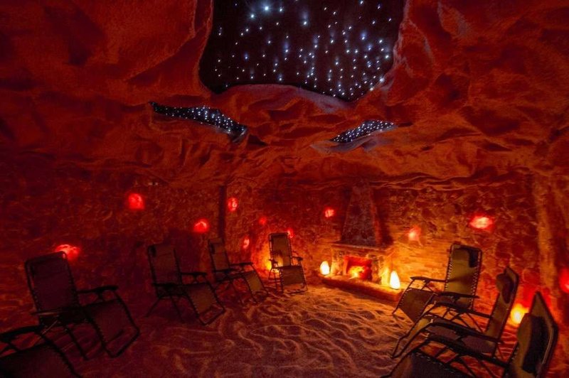 Himalayan salt cave interior at NY Salt Den in Latham NY near Albany — halotherapy and wellness sessions
